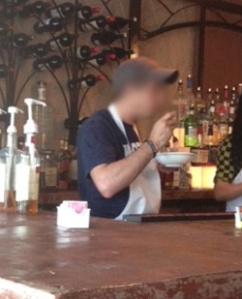 I blurred face - eating at bar.
